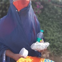 Street Dwellers receiving food packets, bed sheets